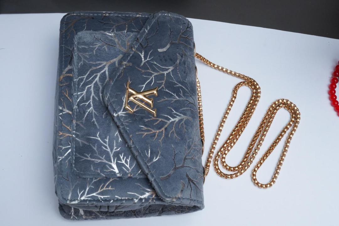 Woman's velvet Textured purse with chain